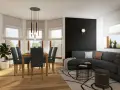 Nowoczesny salon z jadalnią, gdzie wykusz w domu doświetla stół z krzesłami.