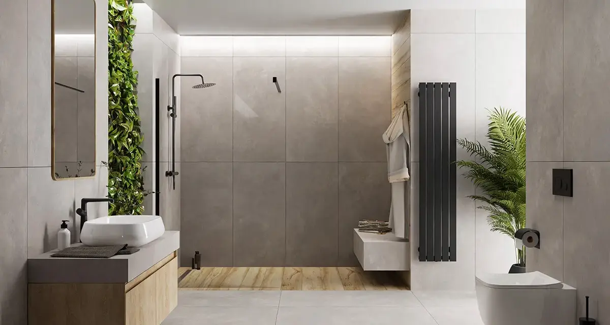 Nowoczesna łazienka z zieloną ścianą i betonem architektonicznym. Mikrocement na płytki nadaje jej surowego, ale eleganckiego charakteru.