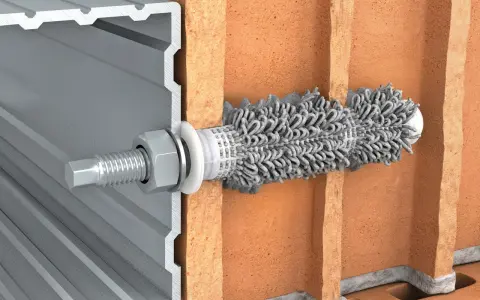 Przekrój przez cegłę pokazuje, jak kotwy chemiczne mocują profil aluminiowy.